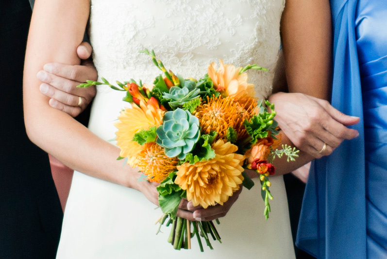 wedding flowers orange dahlias and succulents