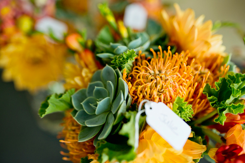 natural orange and green bouquet by red poppy floral design ann arbor