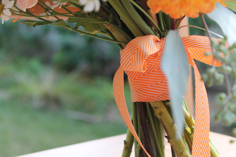 bridal bouquet with orange chevron ribbon