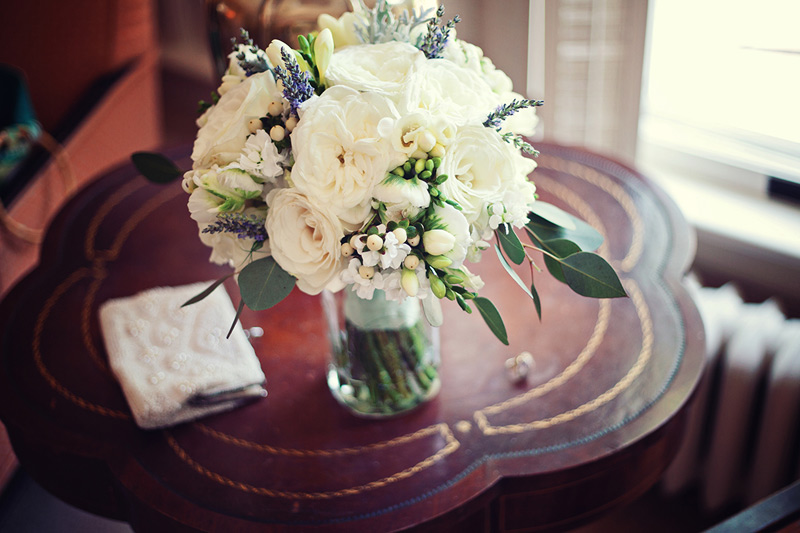 brides bouquet of white garden roses, lavender and fresh herbs