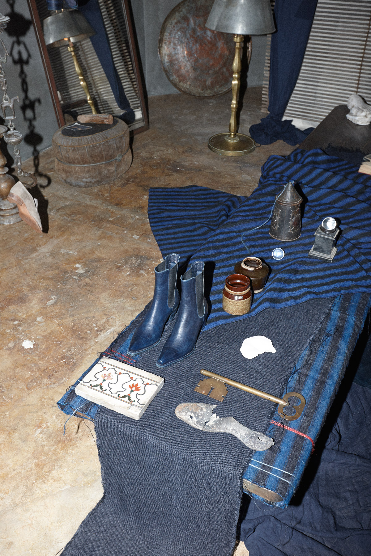 Chelsea boots by Atelier Baba alongside a range of found objects.