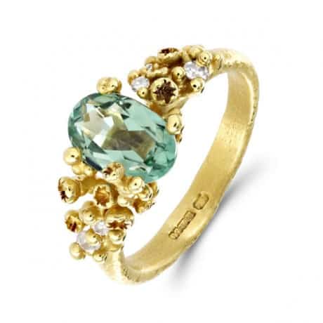 RUTH TOMLINSON. Cluster Oval Green Tourmaline Diamond Gold Ring, £1,580. www.econe.co.uk 