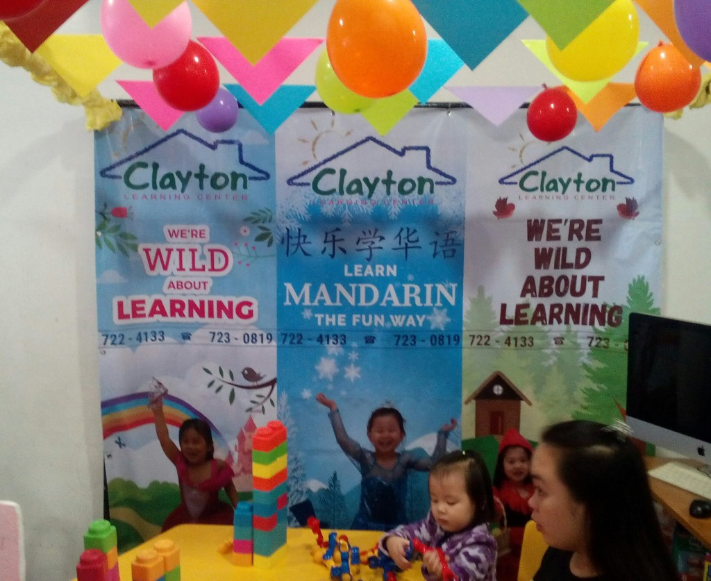 Happy child at the Clayton Learning Center booth