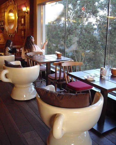 Cup shaped chairs by window