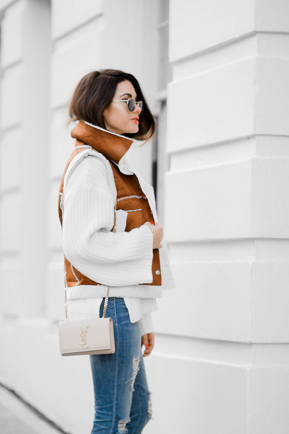 shearling vest outfit idea for winter --- featuring Rachel Zoe Jordy Turtleneck Sweater, Faux-Shearling Vest, Saint Laurent Monogramme Chain Shoulder Bag, Distressed Skinny Jeans, Ray Ban 50mm Retro Round Metal Sunglasses