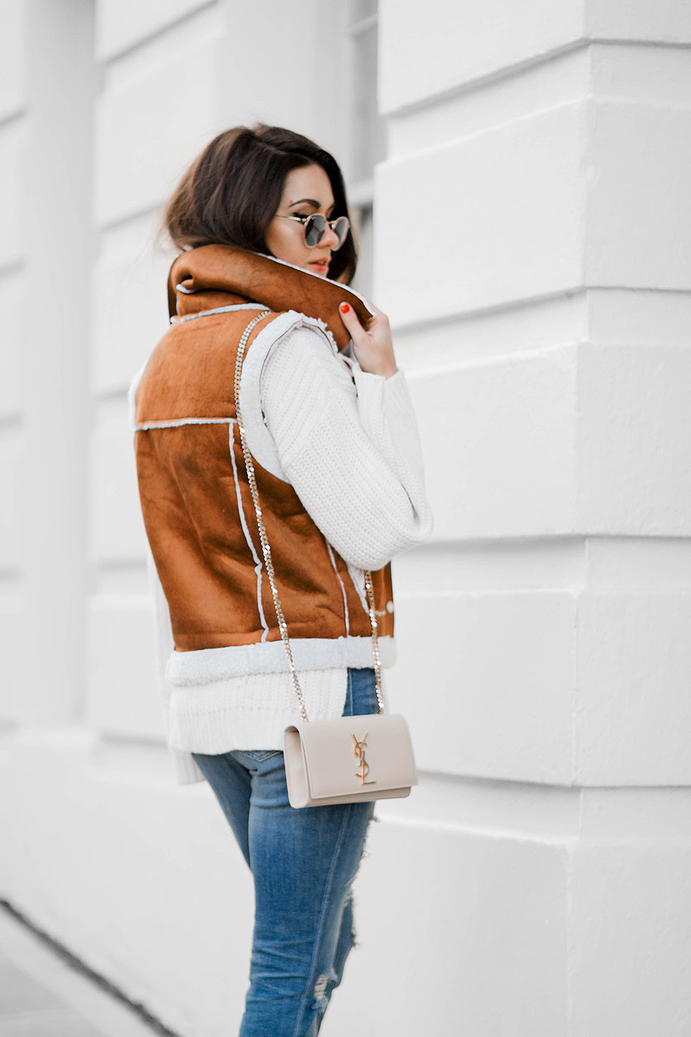 shearling vest outfit idea for winter --- featuring Rachel Zoe Jordy Turtleneck Sweater, Faux-Shearling Vest, Saint Laurent Monogramme Chain Shoulder Bag, Distressed Skinny Jeans, Ray Ban 50mm Retro Round Metal Sunglasses