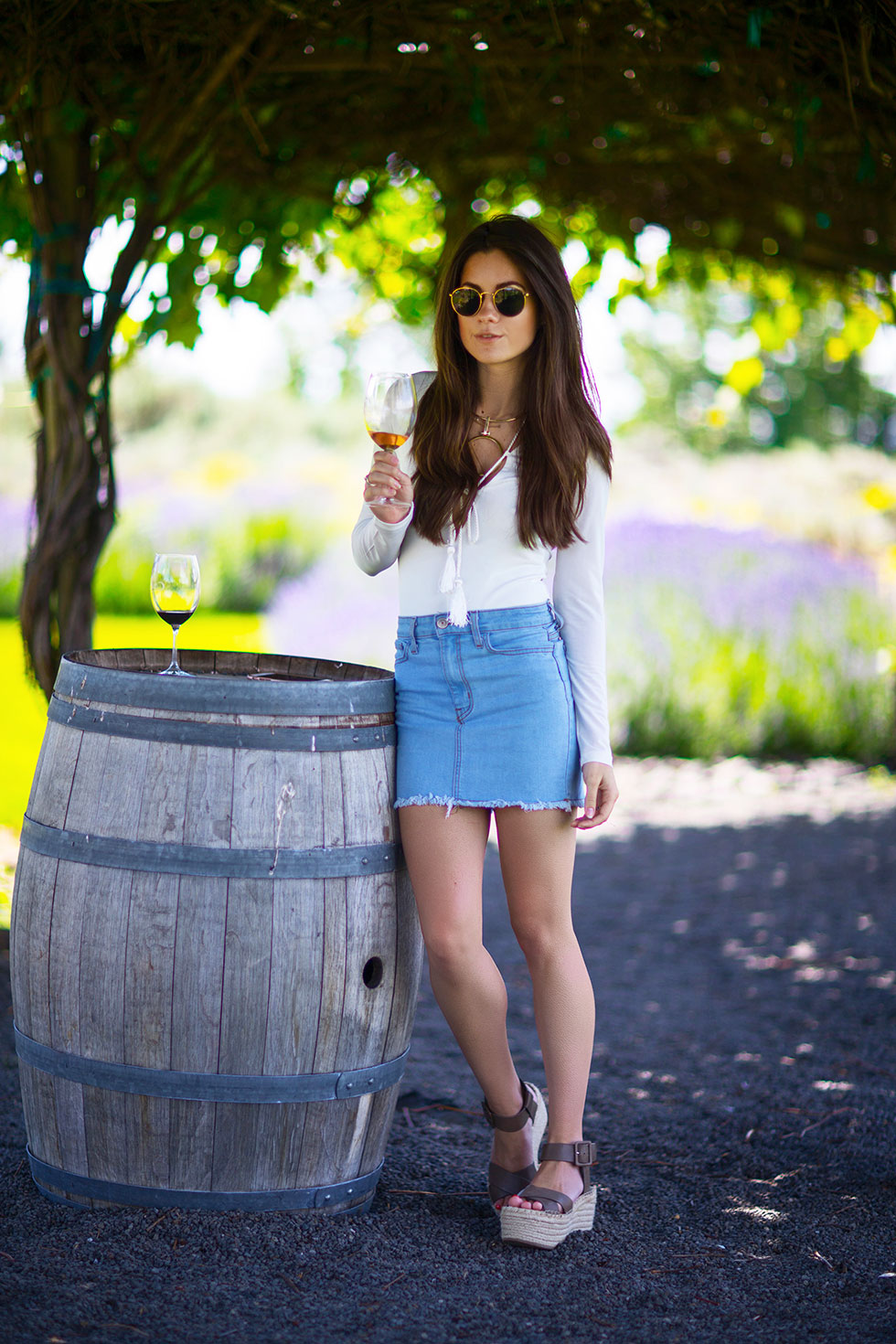 What to wear Summer Wine Tasting - Light Wash Denim Mini Skirt, long sleeve bodysuit with tasseled rope laced around the neckline, Cave B Inn and Spa Washington State Resort Quincy wine tasting-13