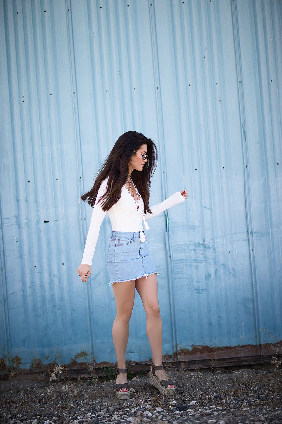 Why You Need A Denim Mini Skirt --- Light Wash Denim Mini Skirt, long sleeve bodysuit with tasseled rope laced around the neckline, Cave B winery, Sasquatch Music Festival, Fashion Blogger, Summer Denim Outfit