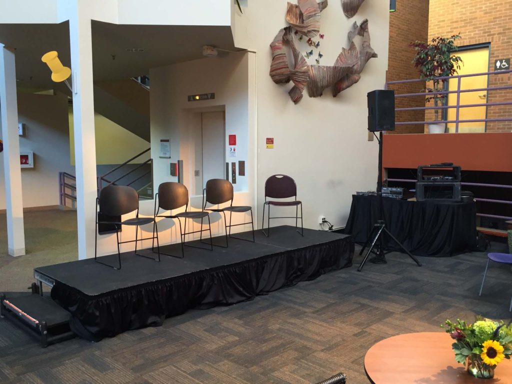 Picture of AV for You audiovisual set-up and staging platform for an event at the University of Minnesota's Learning and Environmental Sciences Building