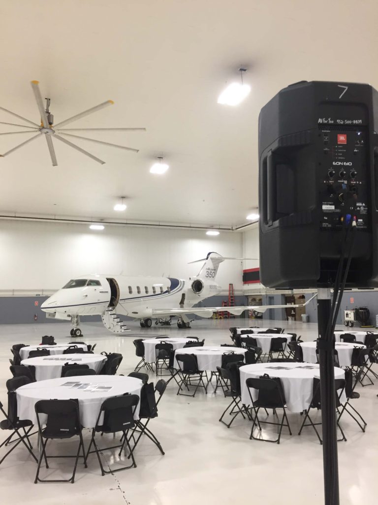 Picture of AV for You audio and visual set-up for the Minnesota Business Aviation Association’s October Luncheon at the Best Jets International aircraft hangar in Minneapolis