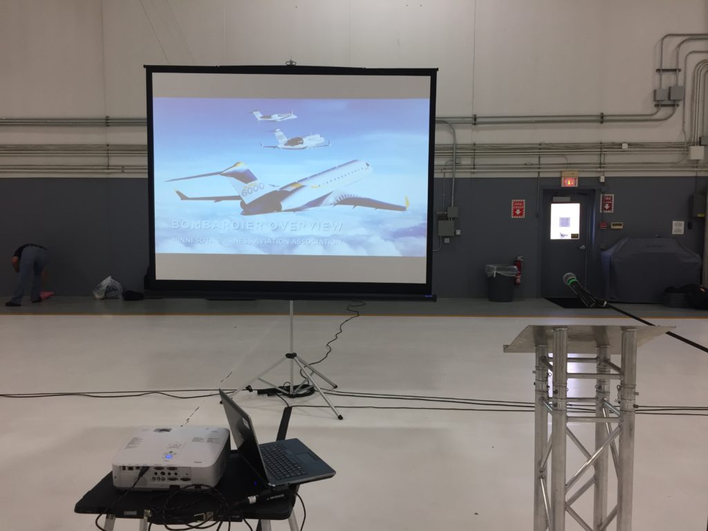 Picture of AV for You audio and visual set-up for the Minnesota Business Aviation Association’s October Luncheon at the Best Jets International aircraft hangar in Minneapolis
