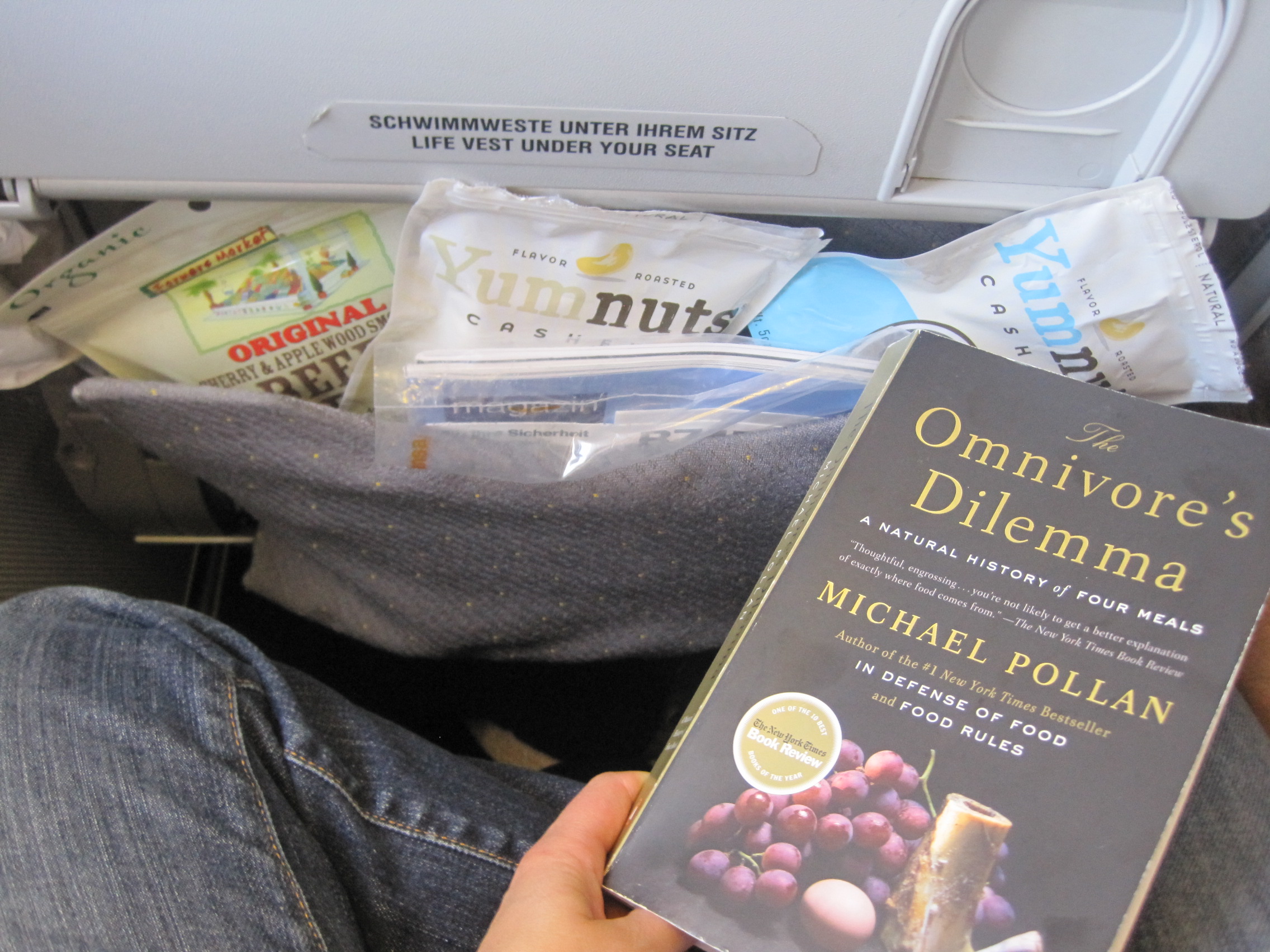 On a flight to Istanbul in July 2011, still packin! I see some beef jerky and plenty of "YumNuts" from Whole Foods! Don't forget to bring a good read!