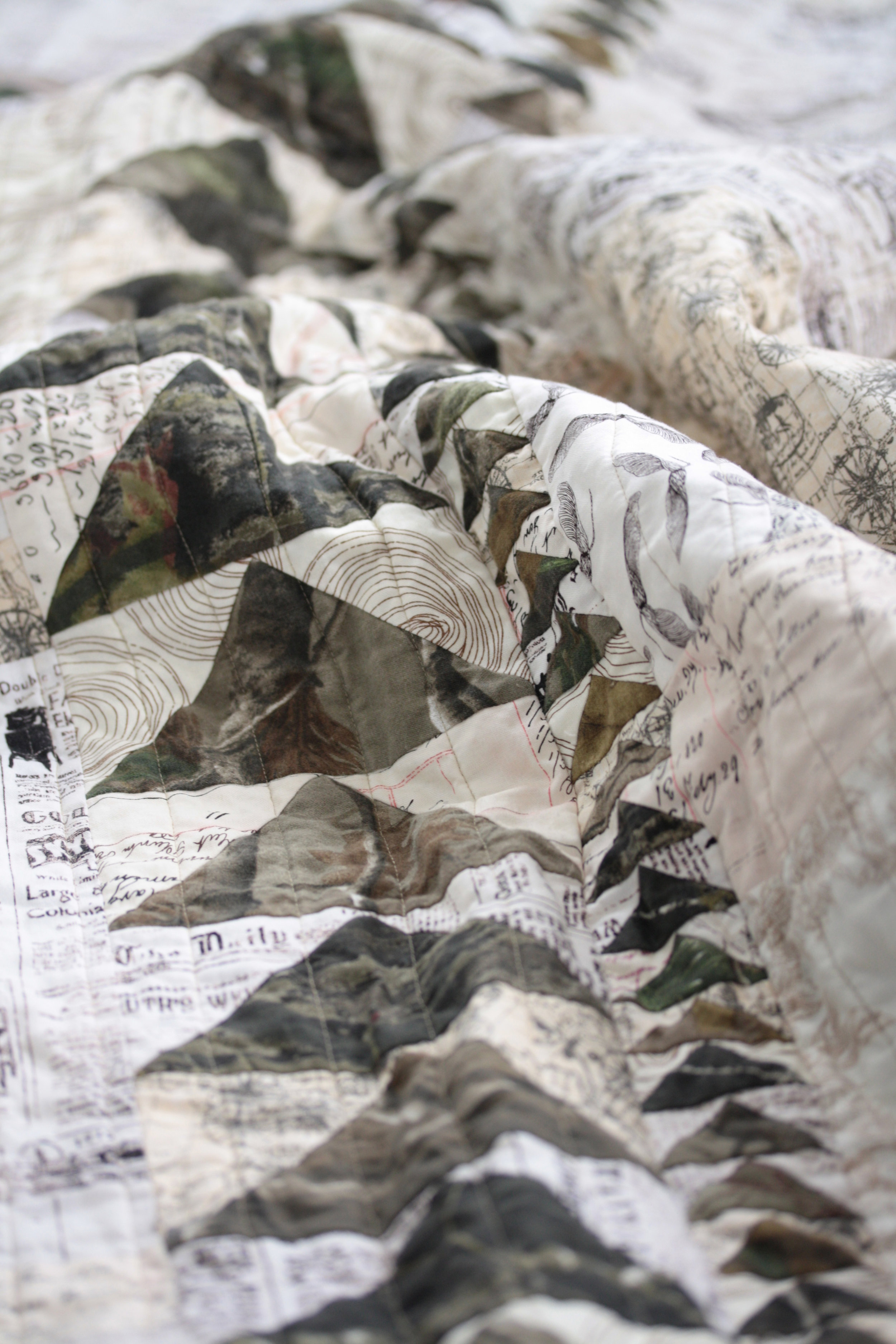 row of geese on camouflage quilt