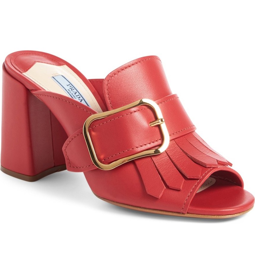  Prada Kiltie Fringe Buckle Strap Mule. Available in red, black. Nordstrom. Was: $750. Now: $449. 