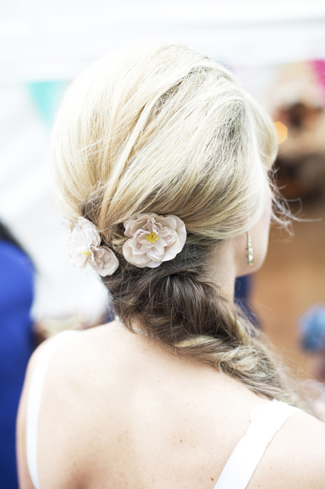 Detail of flowers in brides' hair by Gil Fox