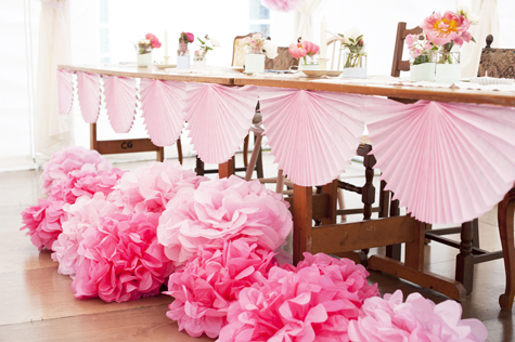 Pompoms and fans decorating the wedding tables