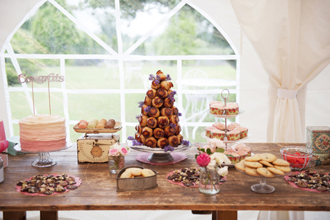 Table with wedding cake, croque en bouche profiteroles and other sweet treats