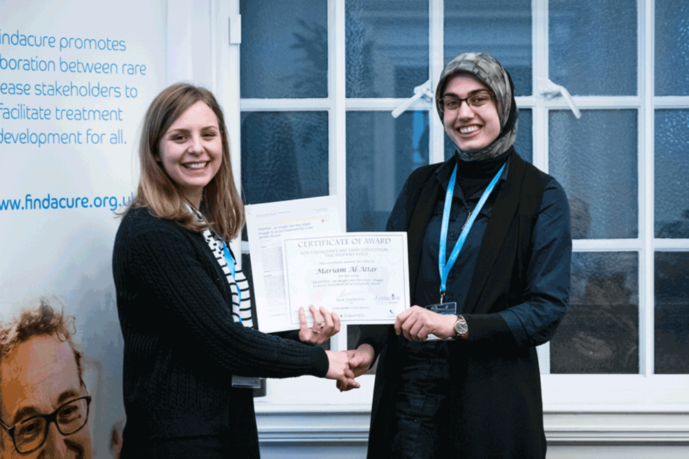  Photo of Mariam receiving her essay prize at The Findacure Drug Repurposing Conference 27th February 2018. 