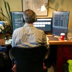 Our developer Ben and his three monitors.