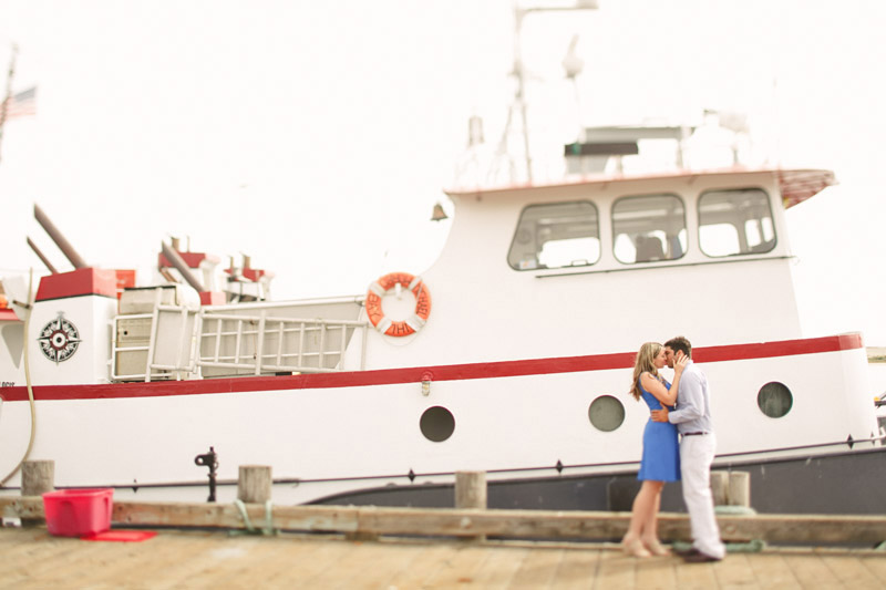 Morro Bay, couple kissing by boat