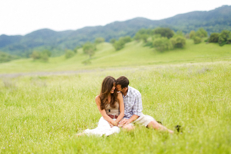 Santa Margarita Ranch, engagement photos of couple sitting in a field