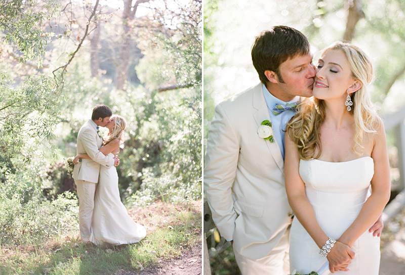 Central Coast Avila Beach Golf Course wedding pictures of bride and groom kissing in front of trees.