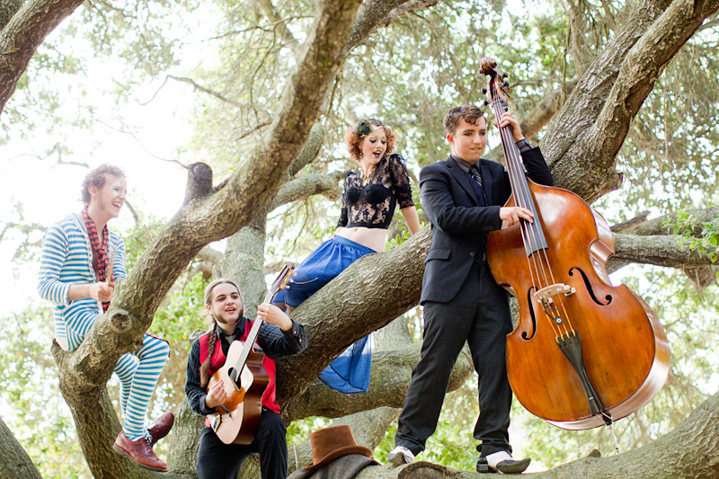 Loriana Ranch, San Luis Obispo Vintage Circus Freak Show Blue Bird inspiration shoot of Redskunk Band playing music in a tree (4 of 5)