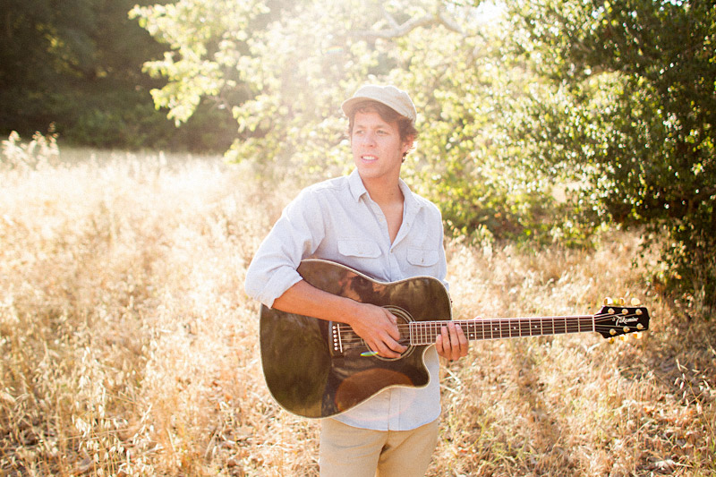 Joel VanZ central coast wedding videographer and musician hanging out in a field (2 of 8)  
