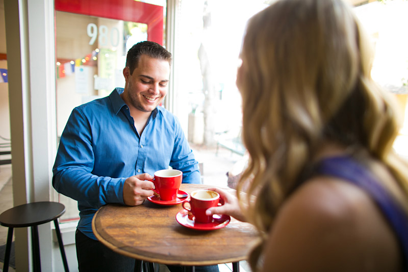 San Luis Obispo Engagement pictures of couple drinking coffee at cafe out of a red cup. (2 of 2)
