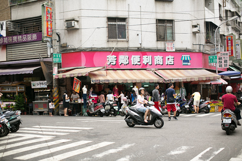 Taiwan street market with scooters.