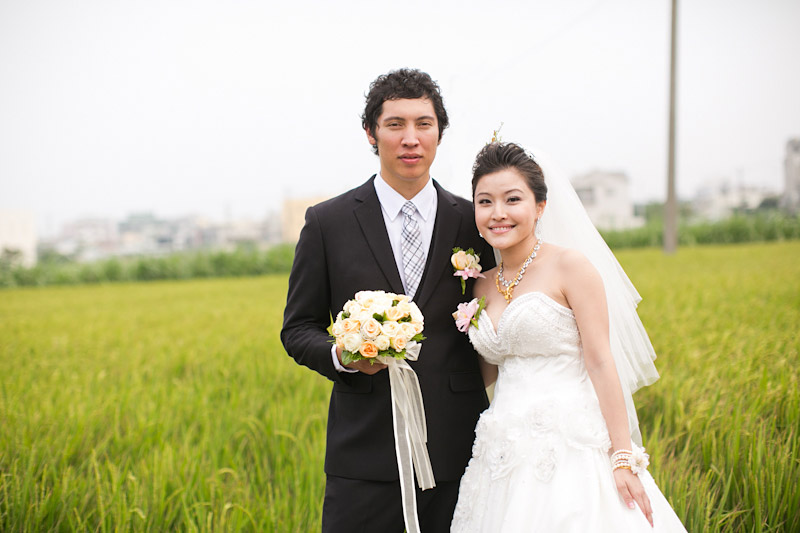 Taiwan wedding. Couple in rice field.
