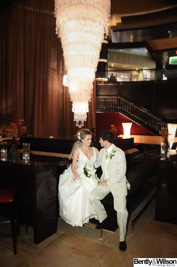 bride and groom red rock chandelier