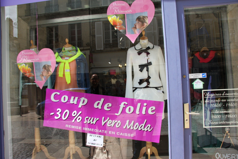 Cute clothes in a shop window in Avallon, France