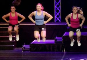 Alysse Blight (center) performs in the fitness portion of the Distinguished Young Women of America National Scholarship Program contest.