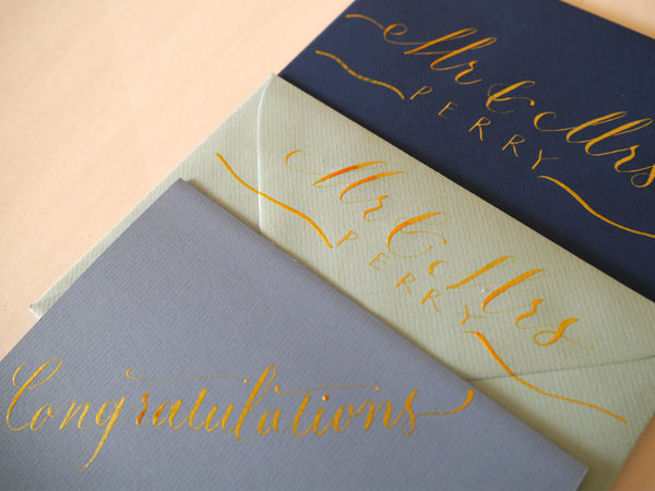 Wedding cards written in gold ink modern calligraphy