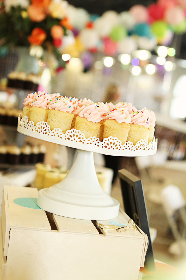 Cute pink sprinkled cupcakes at a confetti party!