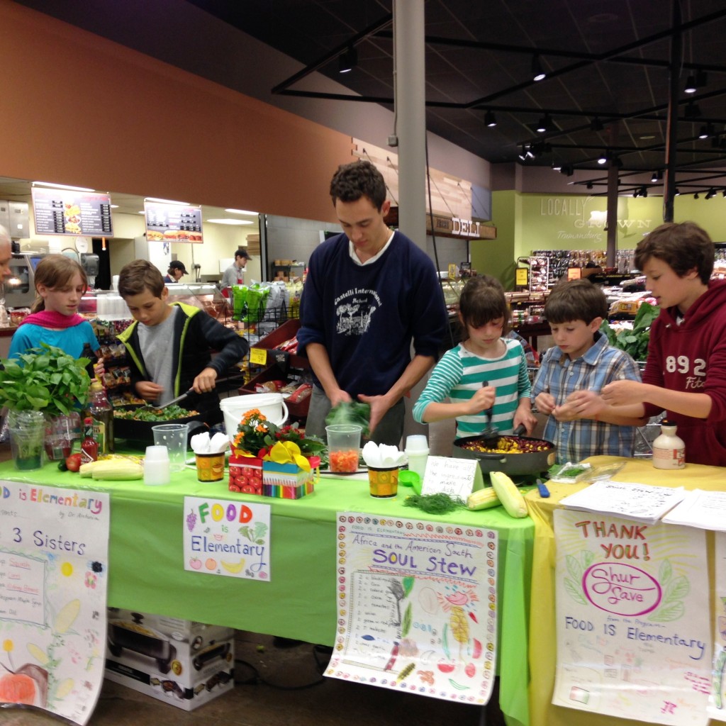 3rd and 4th grade students gathered at Sure Save on Sunday 5/31 to do a demonstration of two of the dishes they learned about in the Food Is Elementary program