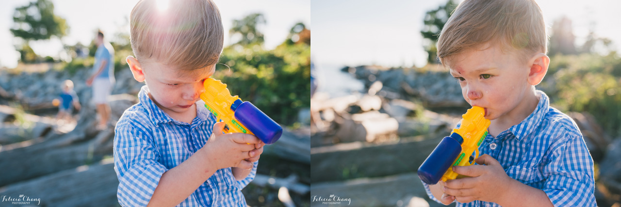 boy creatively using water guns, vancouver family photographer, Felicia Chang Photography