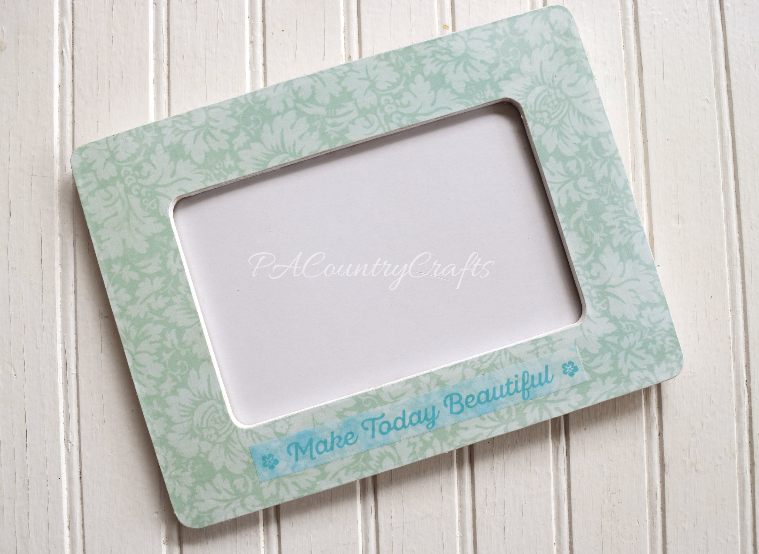 Mod podge, scrapbook paper, and washi tape make this cute frame!