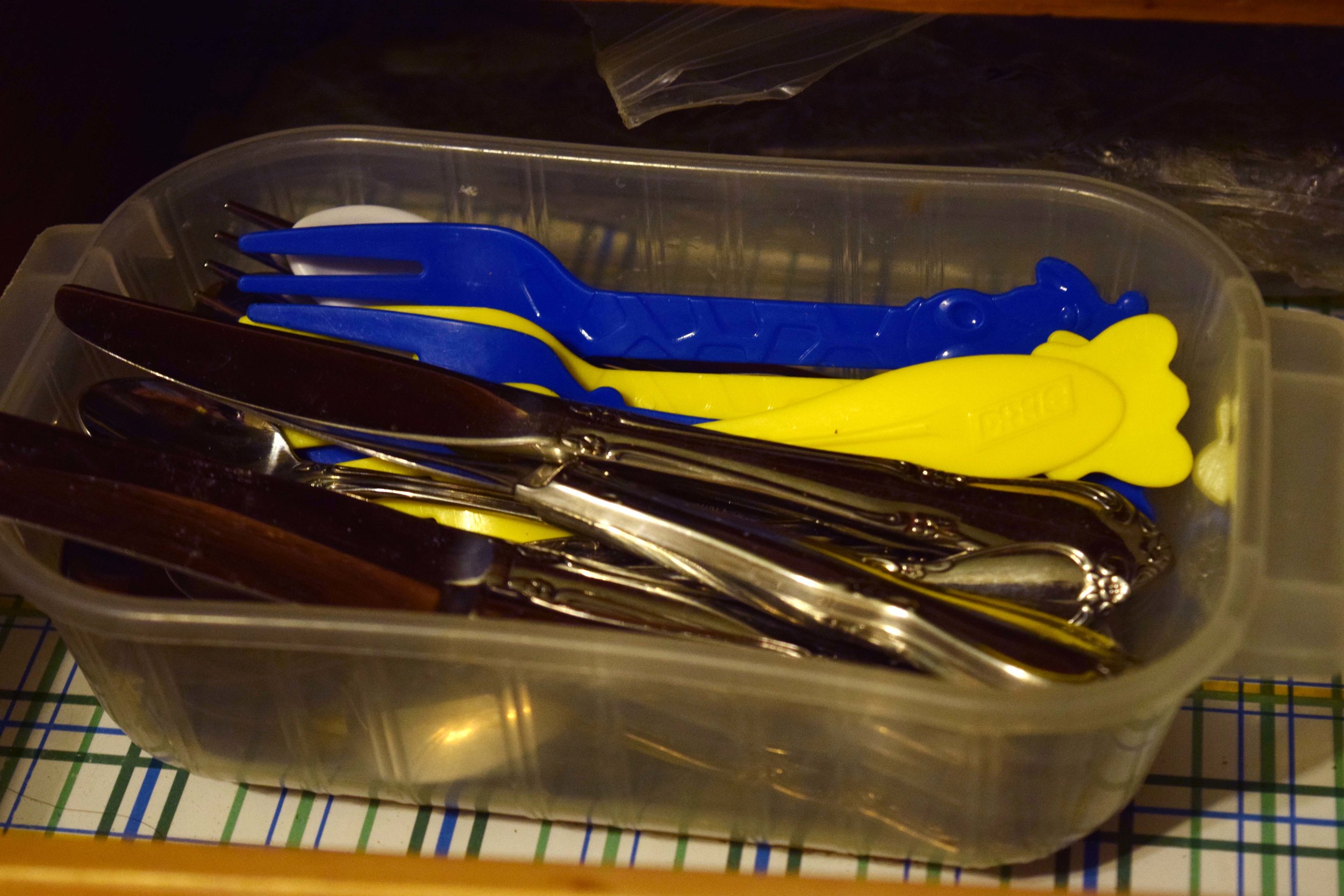 use storage containers with missing lids to organize drawers