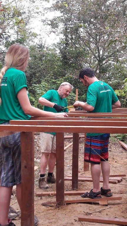 Volunteers get to grips with basic construction work, 2016.