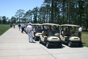 Golfers lining up with their caddies for the shotgun start!