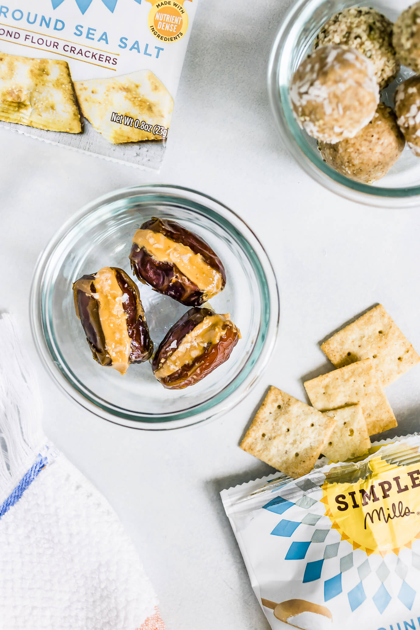 5 Simple Healthy Snacks for Summer featuring Simple Mills Almond Flour Crackers, peanut butter stuffed dates and cashew coconut snack bites