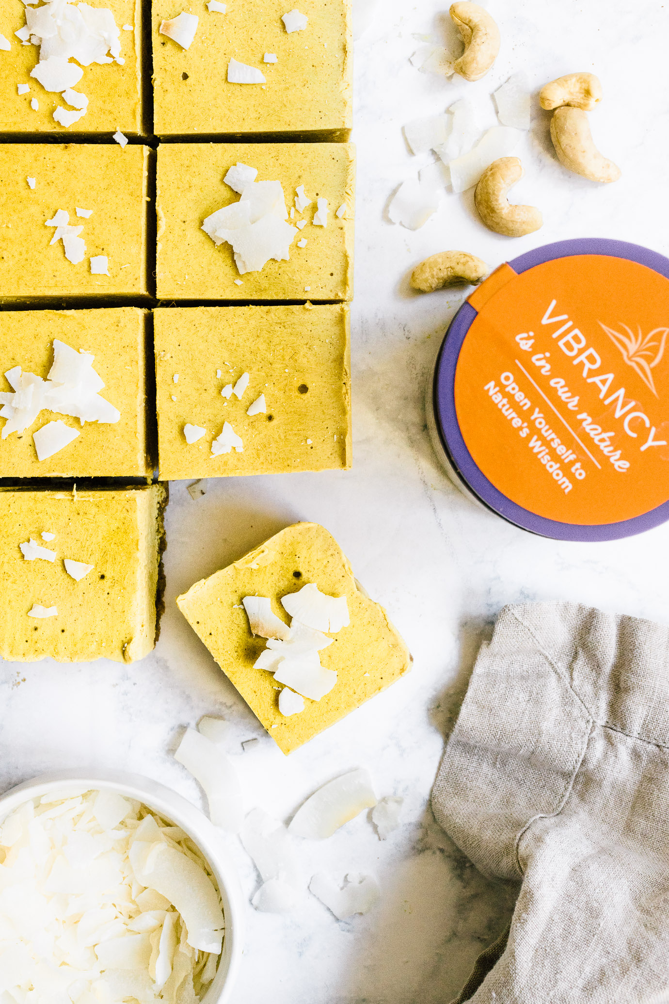 Sliced Golden Milk Cheesecake Bars with New Chapter Turmeric Booster