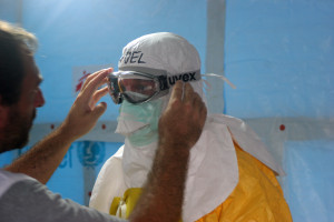 "Preparing to enter Ebola treatment unit (3)" by CDC Global - Preparing to enter Ebola treatment unit. Licensed under CC BY 2.0 via Wikimedia Commons - http://commons.wikimedia.org/wiki/File:Preparing_to_enter_Ebola_treatment_unit_(3).jpg#mediaviewer/File:Preparing_to_enter_Ebola_treatment_unit_(3).jpg