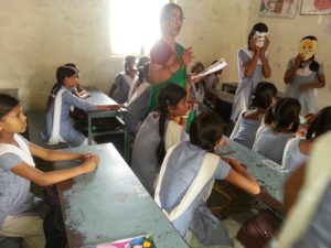A teacher engaging with students in a classroom in India. Source: Flickr