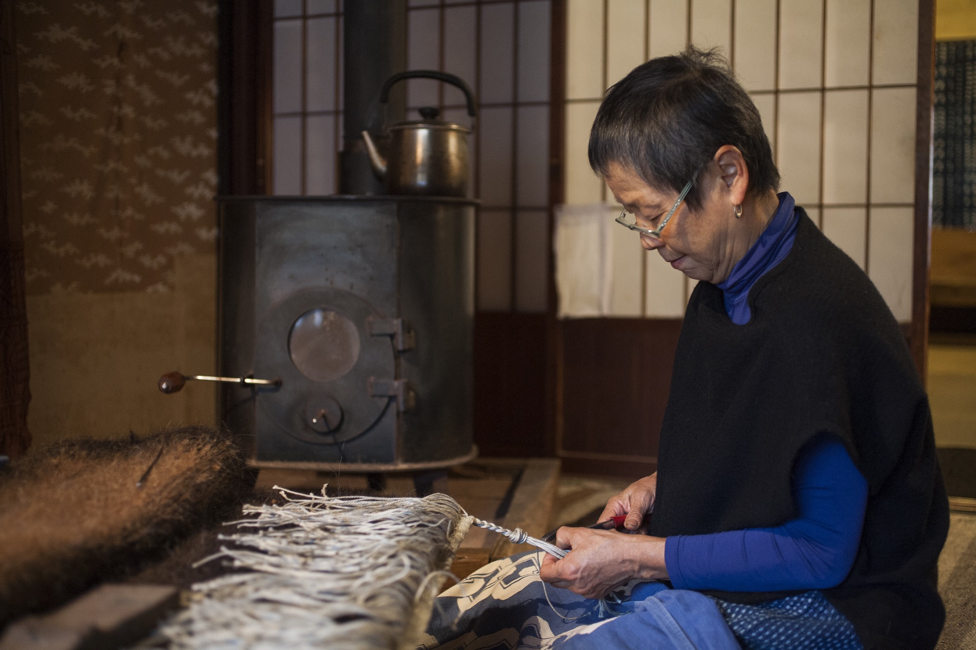 Seki finds creativity in daily life as she weaves rugs from goat hair / Photo by Jimmy Cohrssen