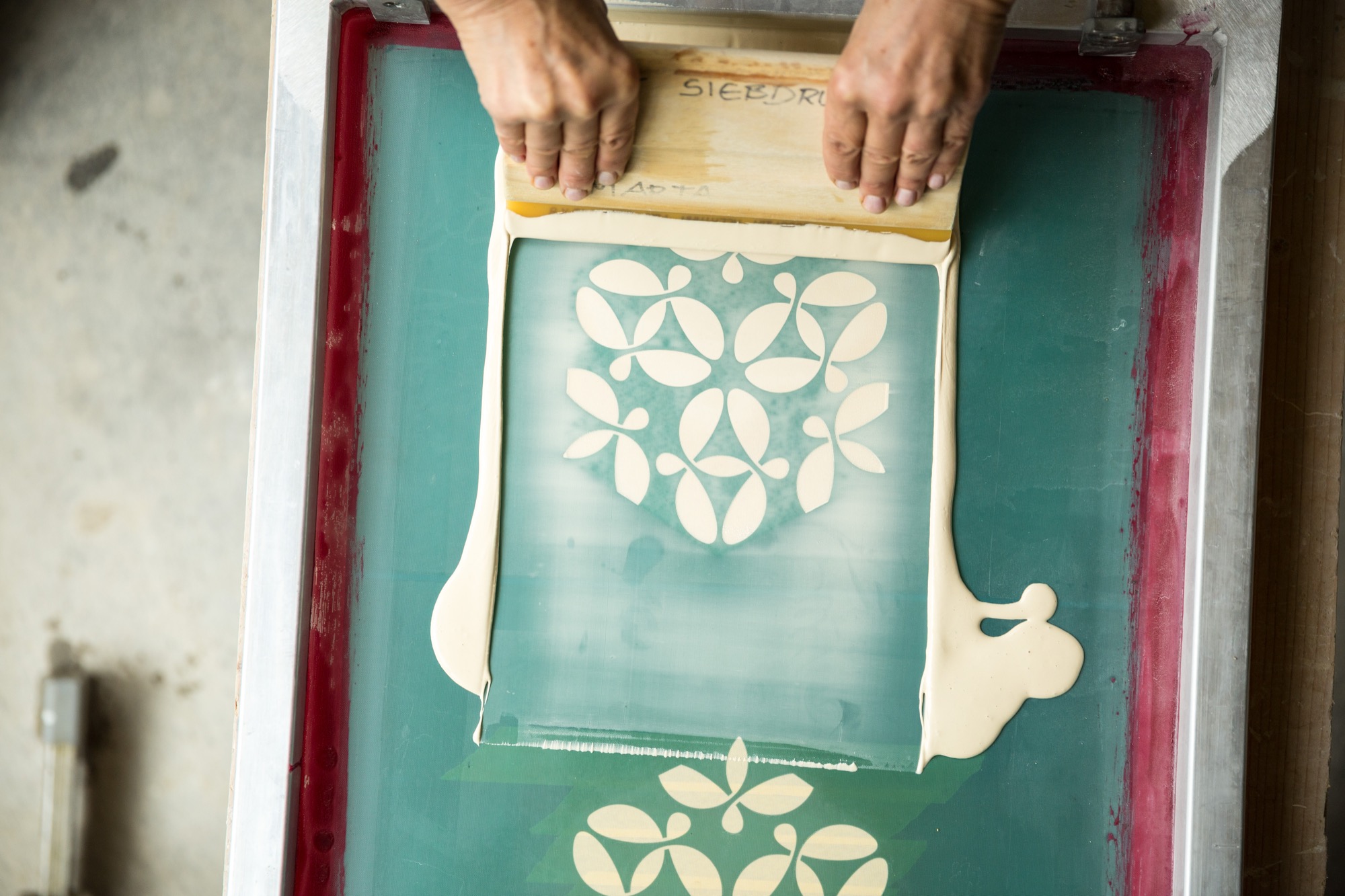 Sebastian's designs are applied to his mother's tiles through silk screening