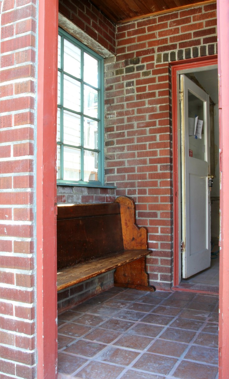 The Grit and Polish - Mudroom old church pew from exterior