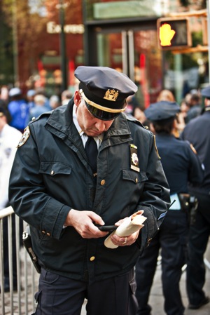 Policeman with cellphone